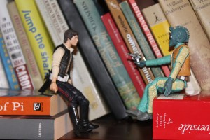 Greedo pulls a piece on Han.